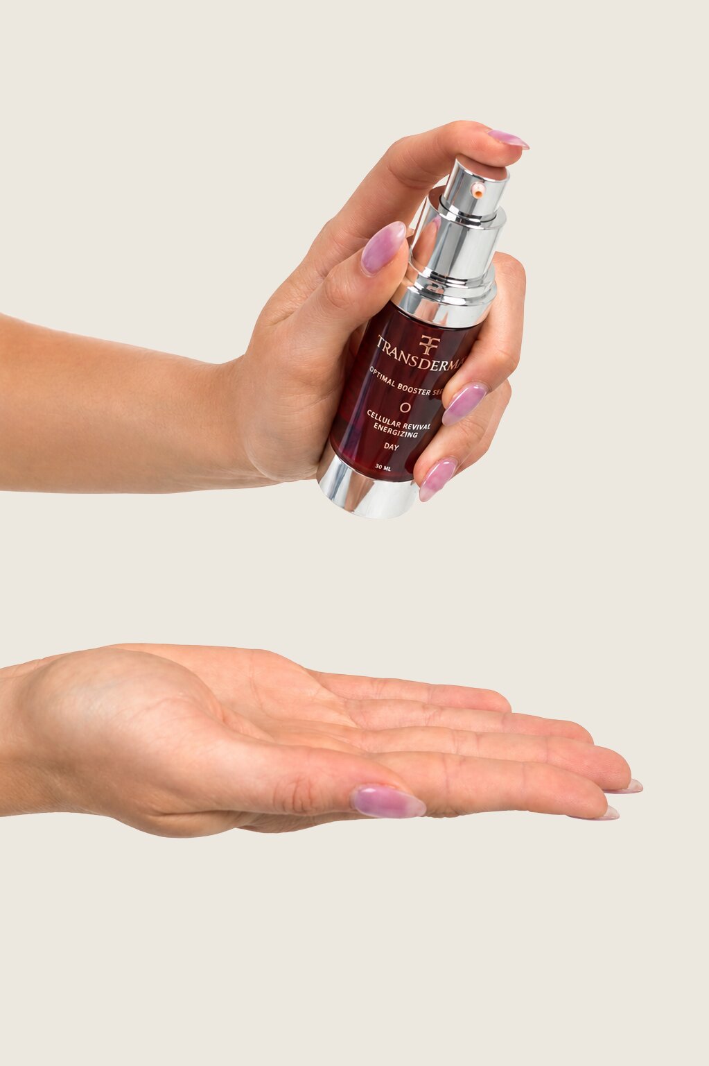 A hand dispensing Transderma serum from its airless pump